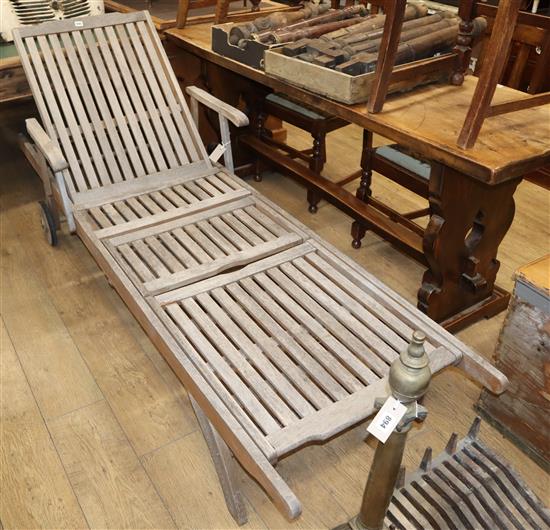 A teak reclining garden lounger